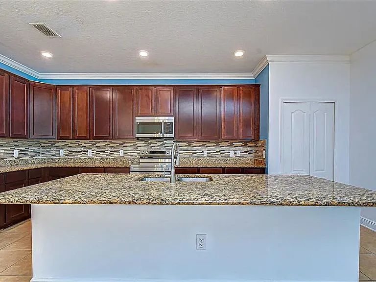 Note: Kitchen accent wall has since been professionally repainted to match the updated interior color scheme. Updated photos coming soon.
