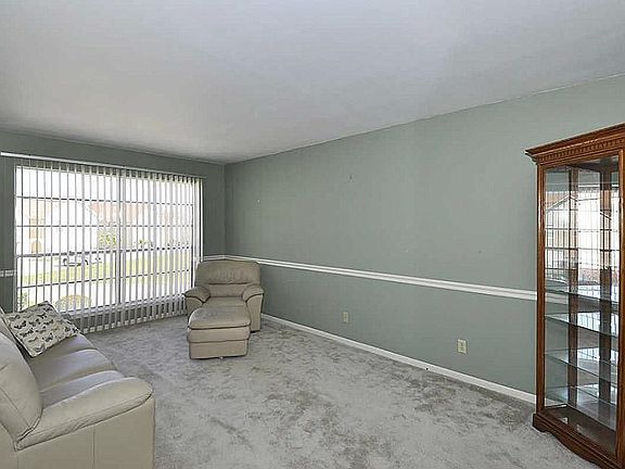 Bright living room directly off kitchen.