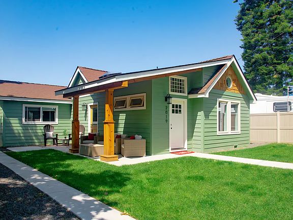 Enjoy a spacious,inviting covered porch perfect for relaxing outdoors.