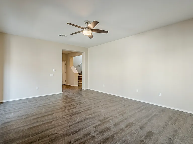 Living room looking towards front door and stairs