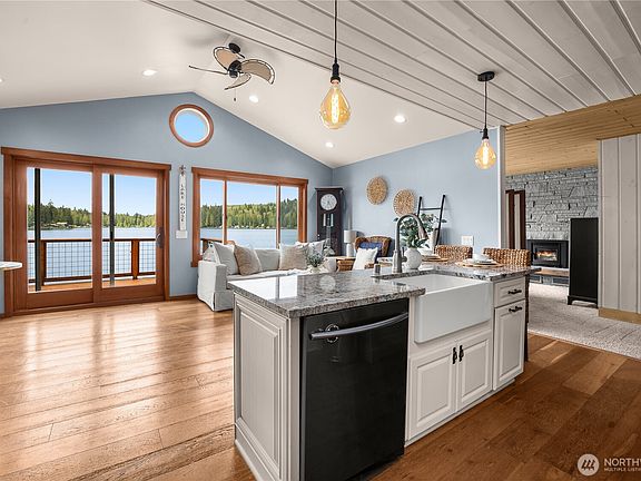 Open concept kitchen, dining and living space>