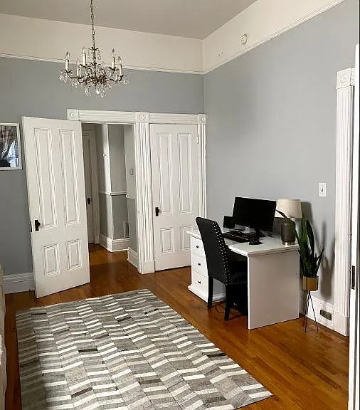 Spacious bedroom with lots of natural light.