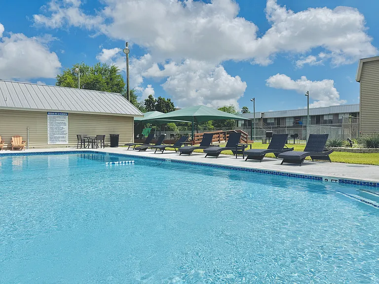 Relax at the sparkling resort-style swimming pool at Borders Apartments Brownsville TX.