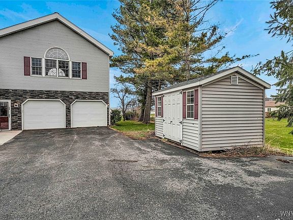2.5 car attached garage and spacious shed for all