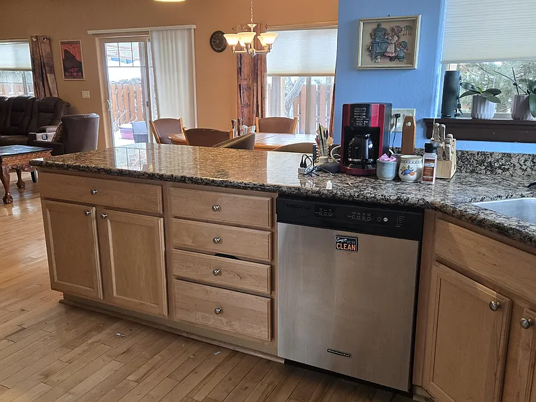 One side of the kitchen, with two chairs for countertop eating.