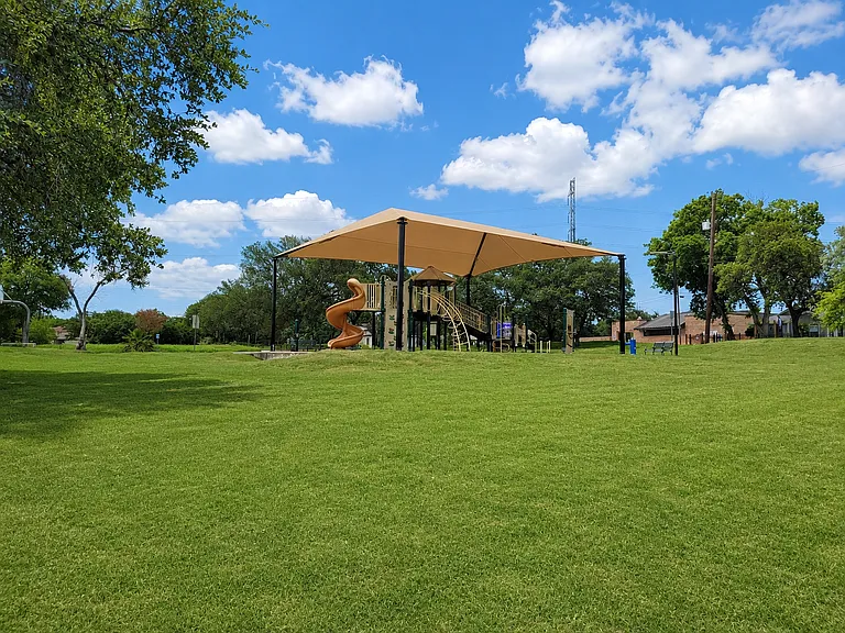 Nearby park within a 10 minute walk offering playgrounds, basketball court, and baseball field.