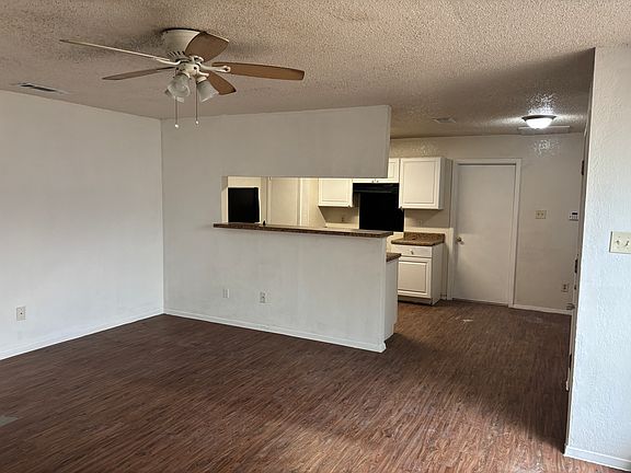 Living room looking into kitchen