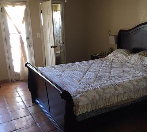 Master bedroom has bathroom and door to backyard