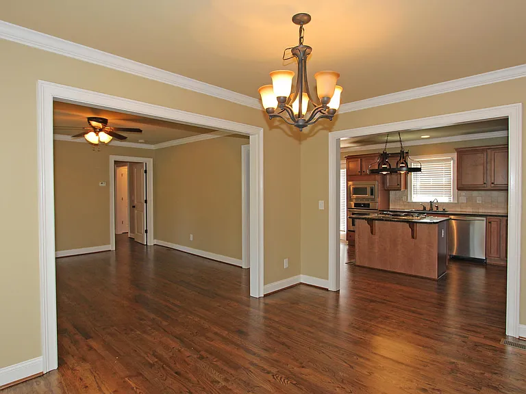 Dining room looking into living room and kitchen