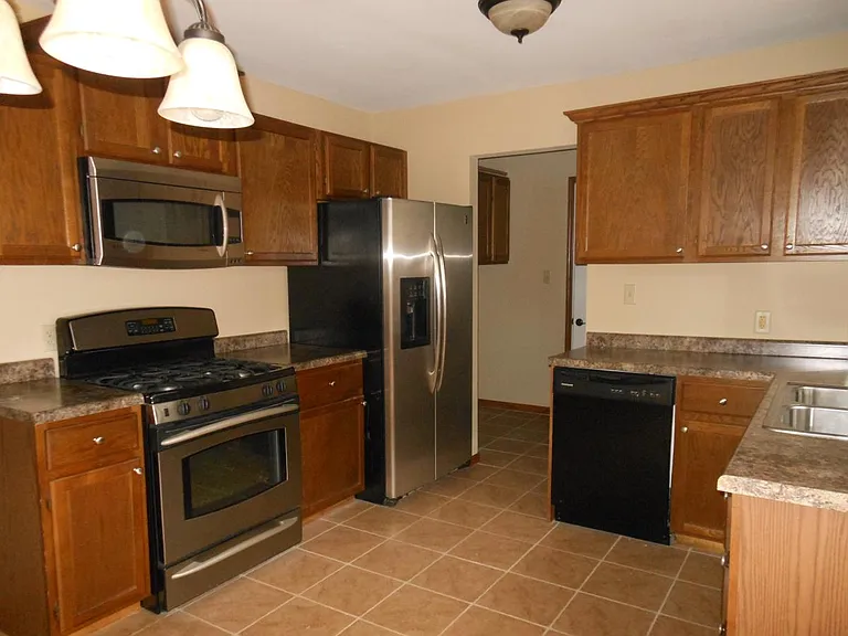 Kitchen contains up graded aplliances