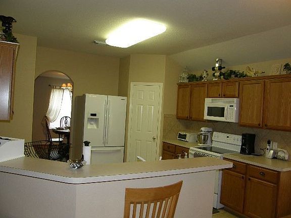Kitchen opens up to family room & breakfast room.