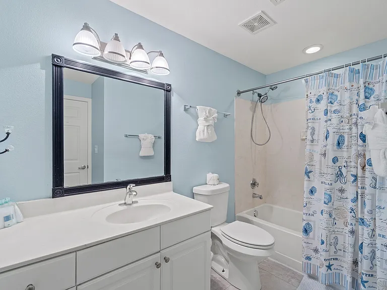 The second guest bedroom also has an ensuite tub/shower combination and vanity.