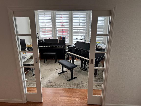 Den with sliding doors