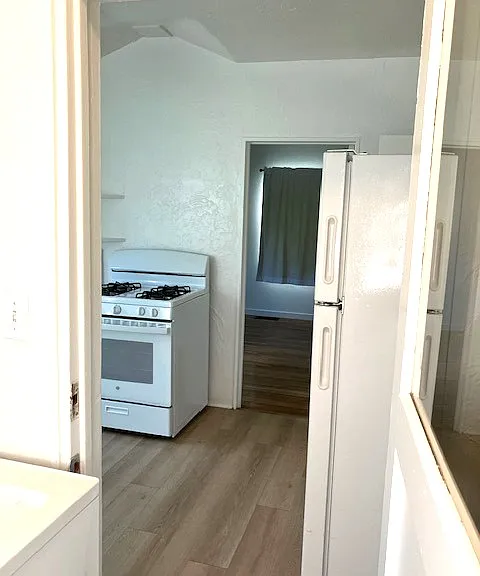 Laundry area looking toward kitchen & back bedroom