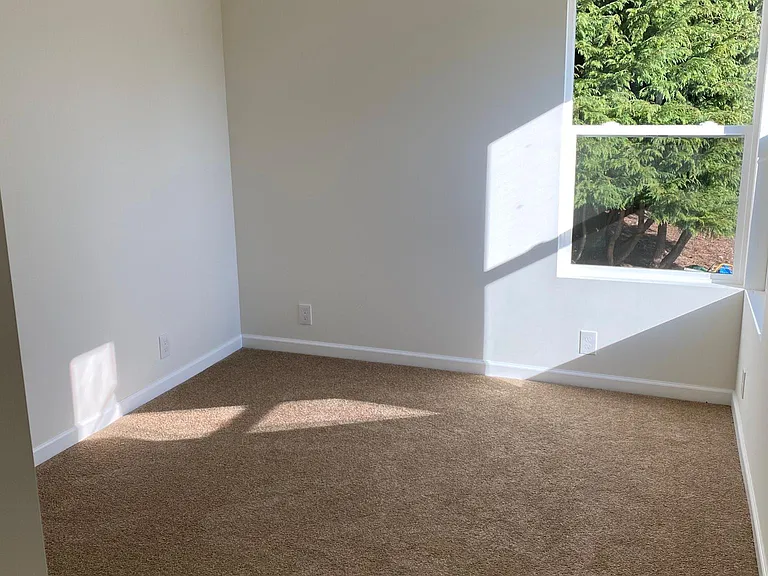 Bedroom main floor. Blinds have been installed since taking this photo.