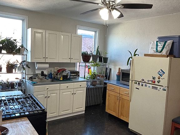 Large eat-in kitchen with ample storage including a built in pantry