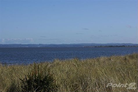 SE view from lot. Greenbelt and beach access to East of lot