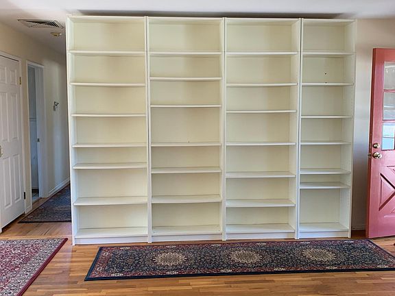 Floor to wall built in shelving in living room
