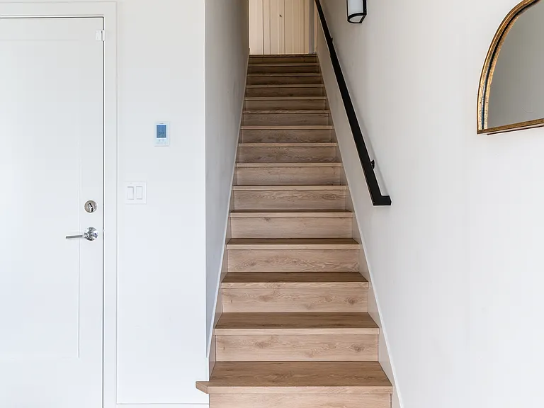 First floor entrance. The door to the garage is next to the staircase and 1st floor bedroom is just to the left of the entrance.
