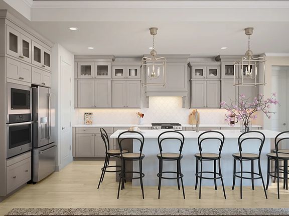 Kitchen with glass upper cabinets and pendant lighting