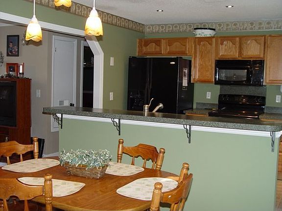 A second look at the eatin kitchen with ceramic tile flooring