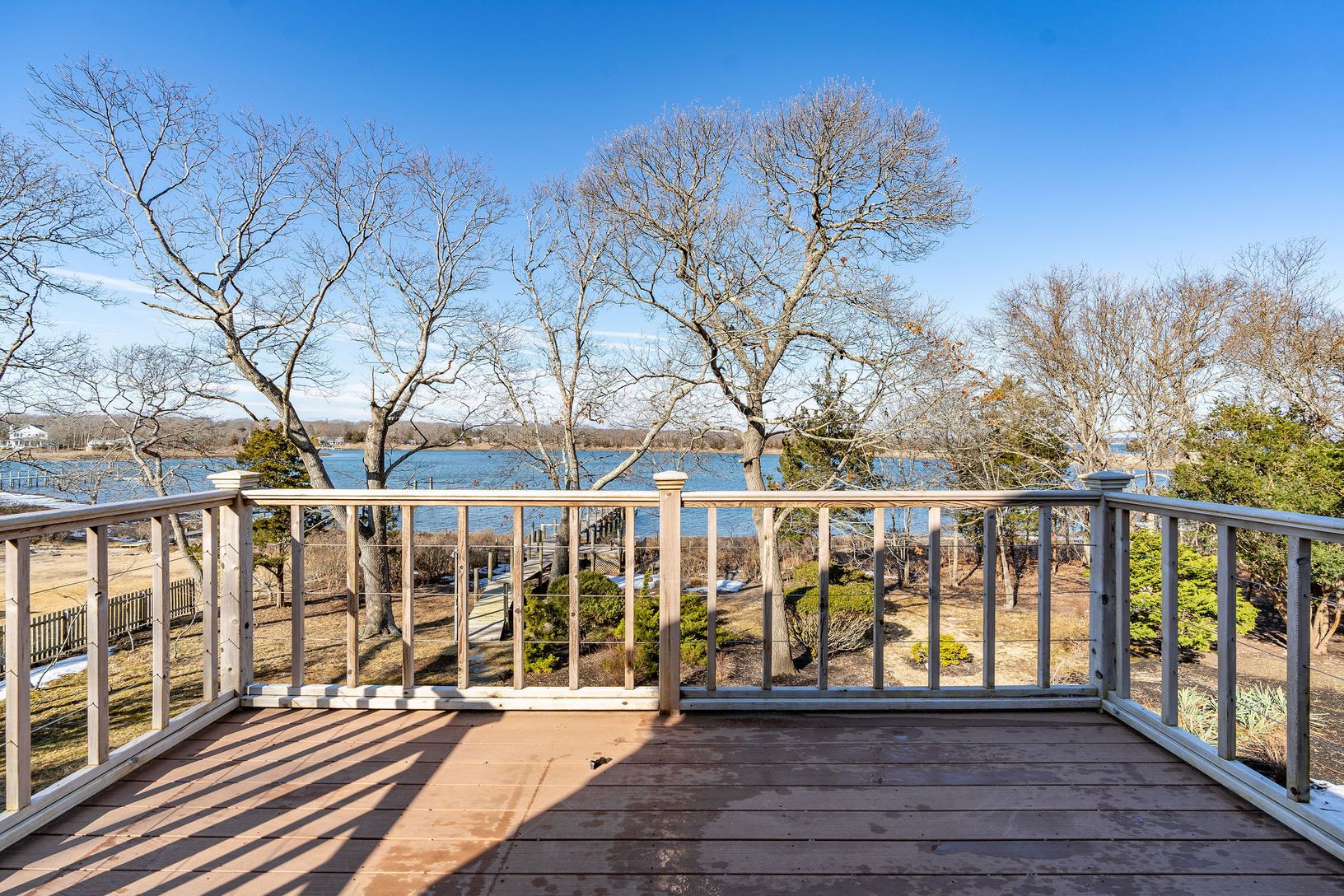  Deck overlooking the water from the upstairs primary suite