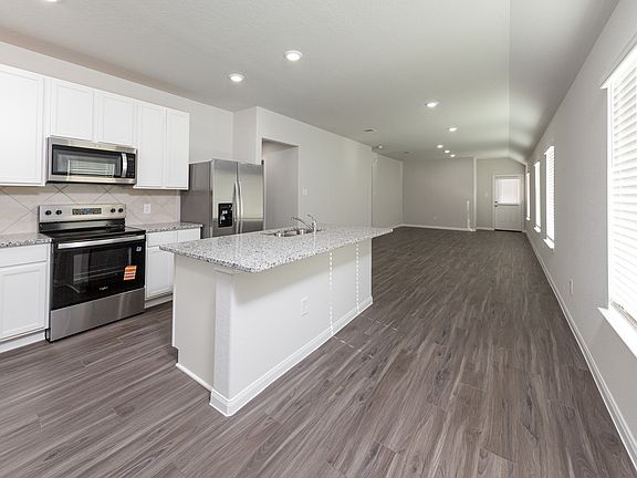 Kitchen to Dining Area and Family Room