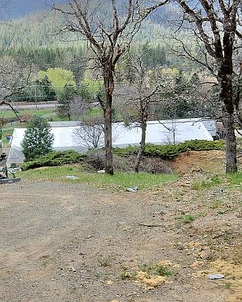 A view of the greenhouse from above the property