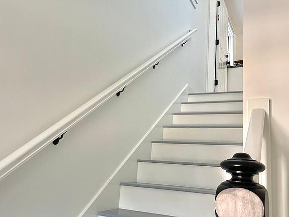 Windows in stairway provide natural light.