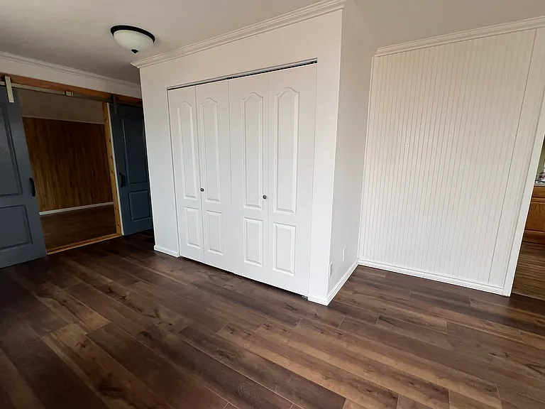 Main room looking toward the laundry room doors.