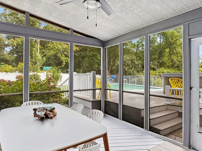 A private sunroom for all to enjoy a day by the pool