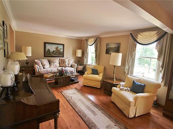 The beautiful living room is accessible from the kitchen and the dining room.