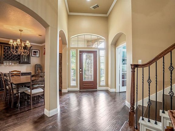 A welcoming foyer with stunning wood floors is a delightful space to greet and welcome your guests.
