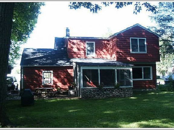 large fenced yard with screened porch