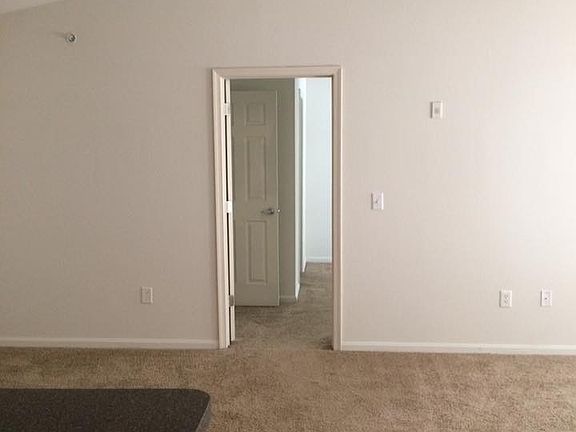 Standing from the hardwood hallway, looking into the main ro