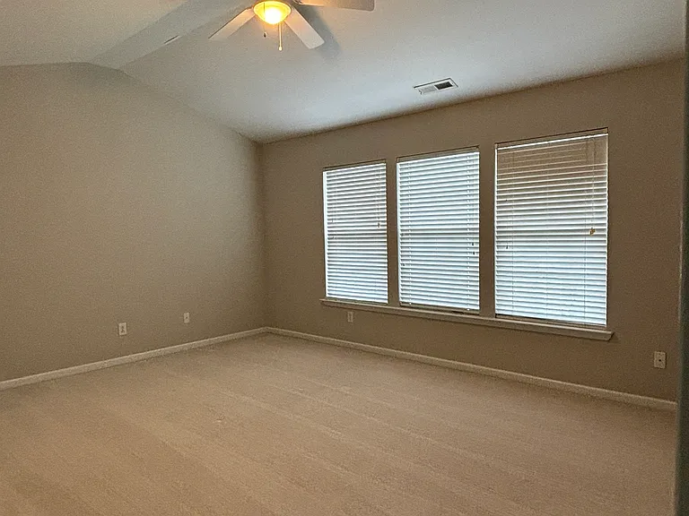 View of Master bed room, with cathedral ceiling.