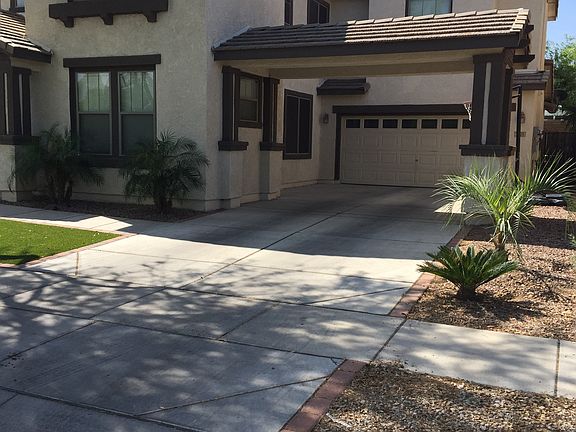 long driveway with carport