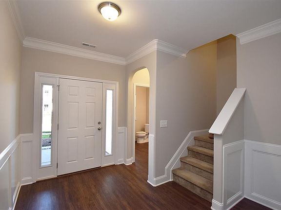 Foyer and hallway to powder room