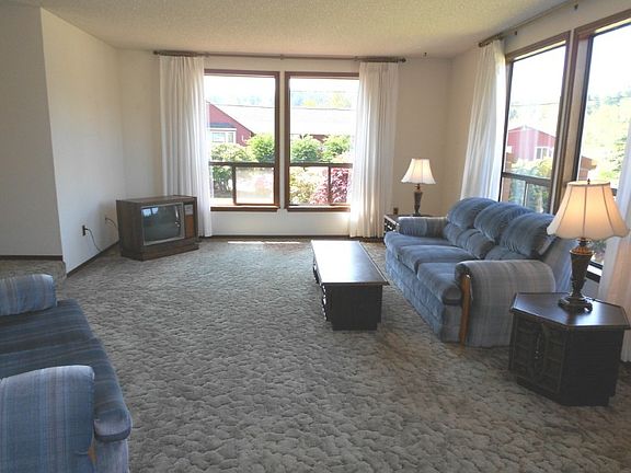 Formal dining room looks into the sunken living room