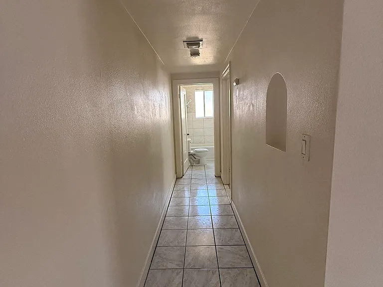 Hallway to bathroom and bedroom