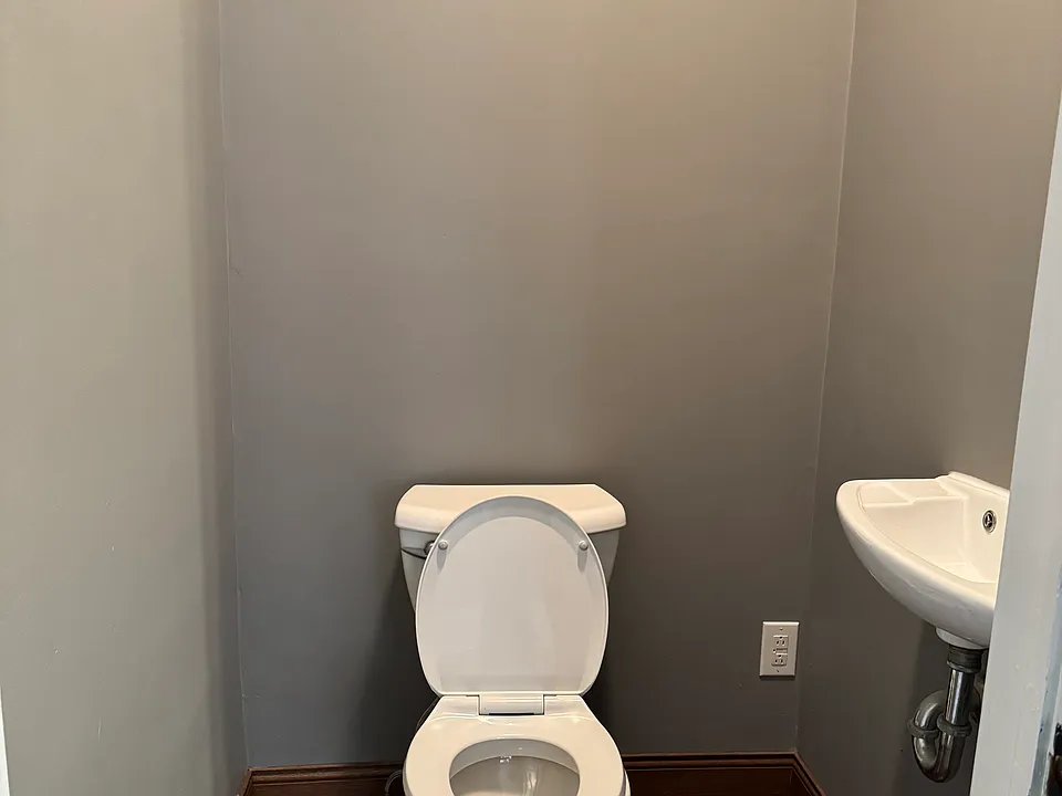 Half bath for guests located off the family room