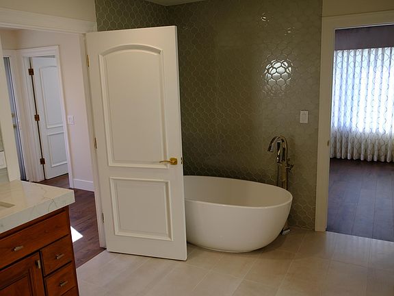 Master bathroom tub and doorway to master bathroom.