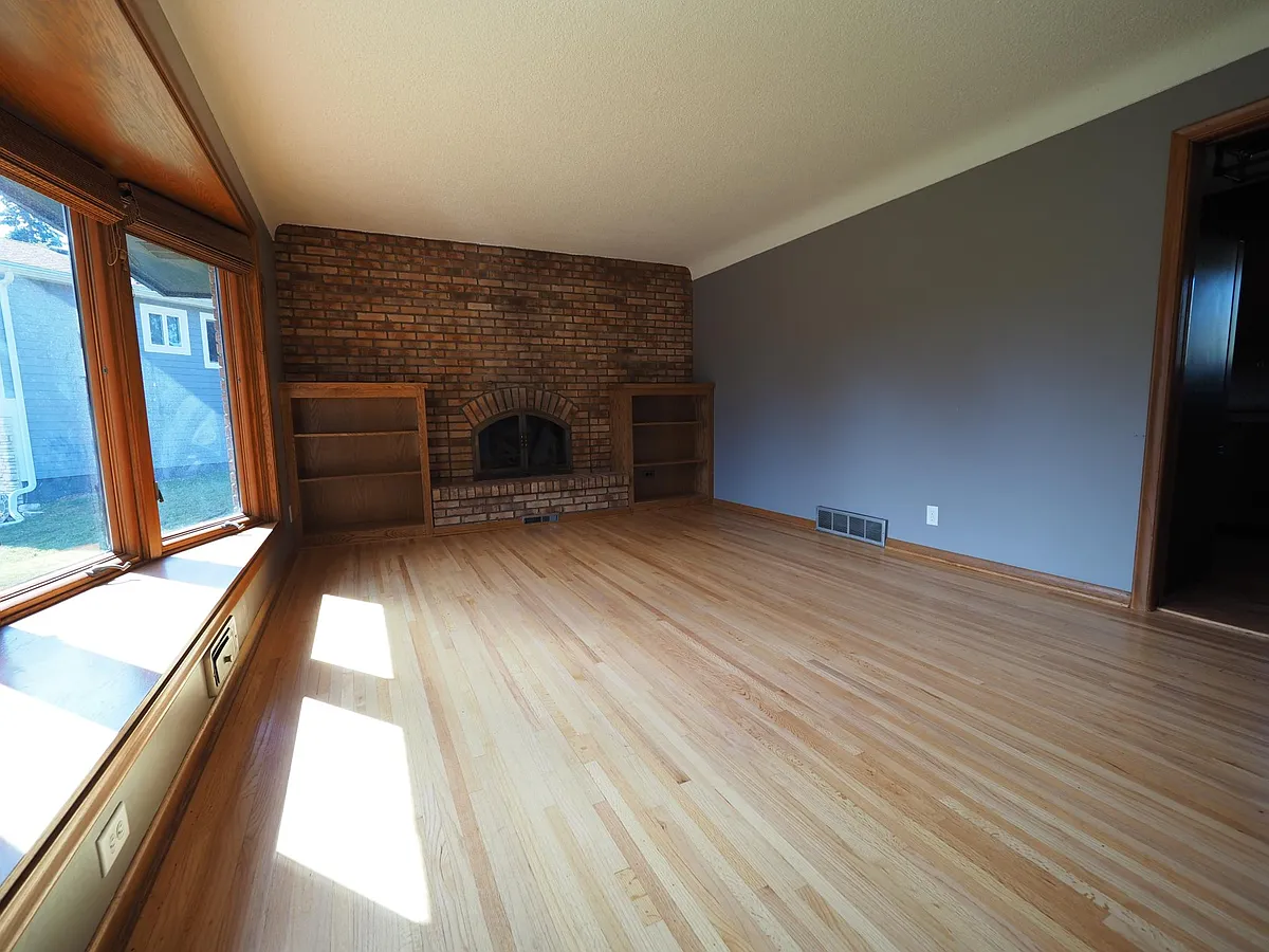 LIVING ROOM with fireplace and built in book shelves. - 1924 Walden Pl NE