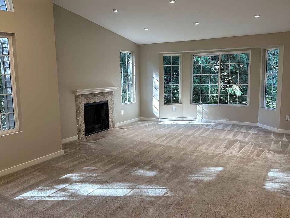 Living room with vaulted ceilings and natural light