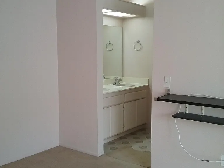 Master bedroom leading to master bathroom
