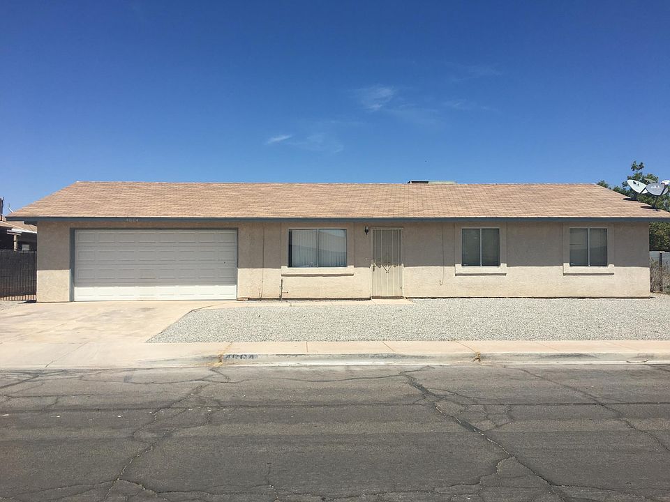 Desert Landscaping in front, blank canvas in back.