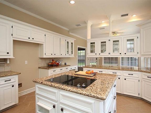 High ceiling and large size make this kitchen a great space.