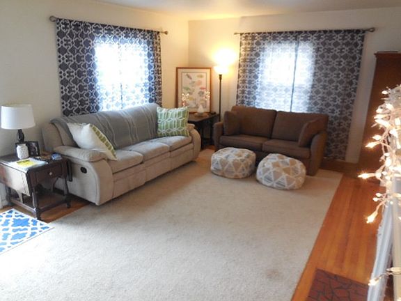 Living Room. Hardwood Floor (area rug belongs to tenant)