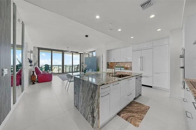 kitchen island has three adjustable swivel stools