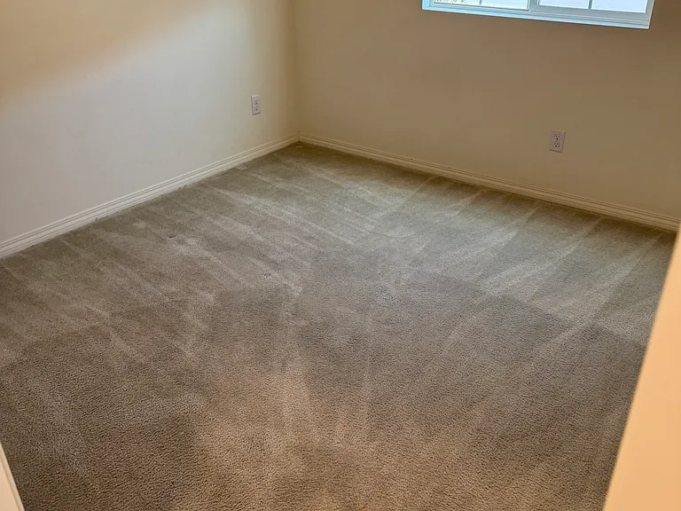 View of downstairs bedroom, with walk-in closet and ceiling fan/light.

Great for office, older children or even multi-generational/in-law(s).